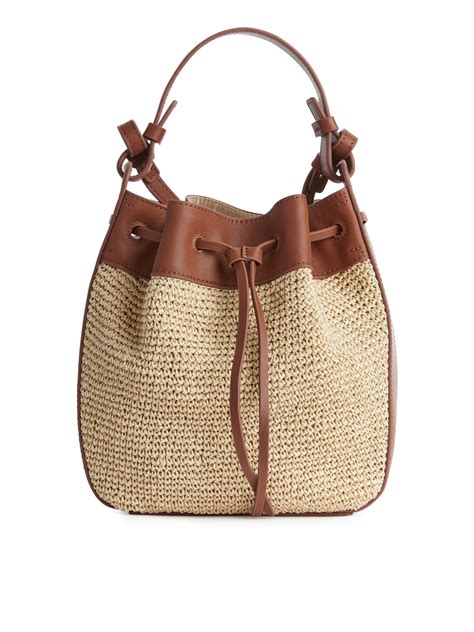 Leather mesh and straw bucket bag Beige/cognac .